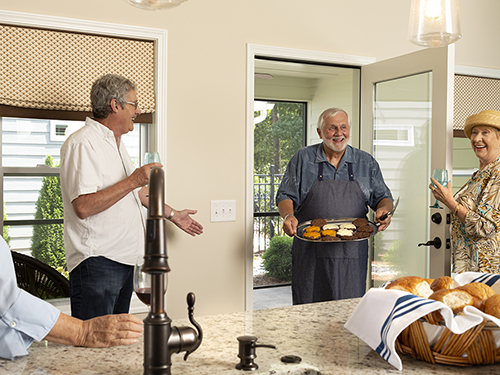 Friends & Neighbors Gathering enjoying a BBQ in the Community>